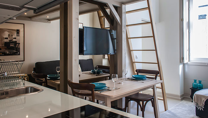 Living and dining room of the 1 bedroom apartment with mezzanine in Chiado, Lisbon